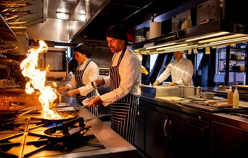 Chef Cooking with an Open Flame in a Commercial Kitchen in Atlanta, GA