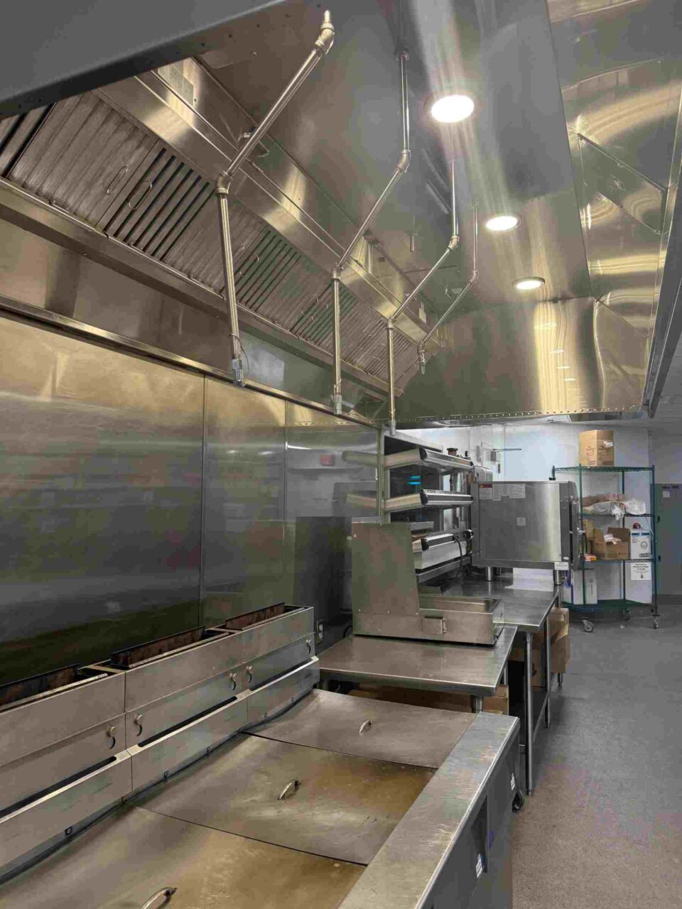 Commercial cookline with stainless steel exhaust hood and fire suppression in Atlanta, GA