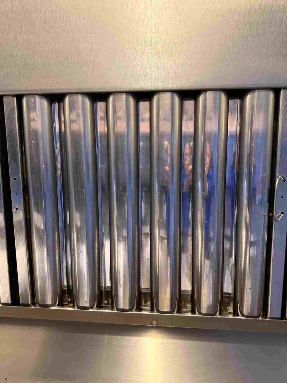 Detailed view of stainless steel grease baffle filters in kitchen ventilation in Atlanta, GA