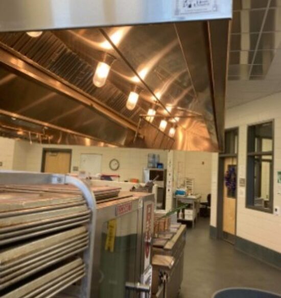 Commercial hood system installed above a food preparation area in Georgia & North Carolina